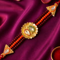 Red Beaded Floral Rakhi with Golden Center and Traditional Festive Gift Appeal Ideas