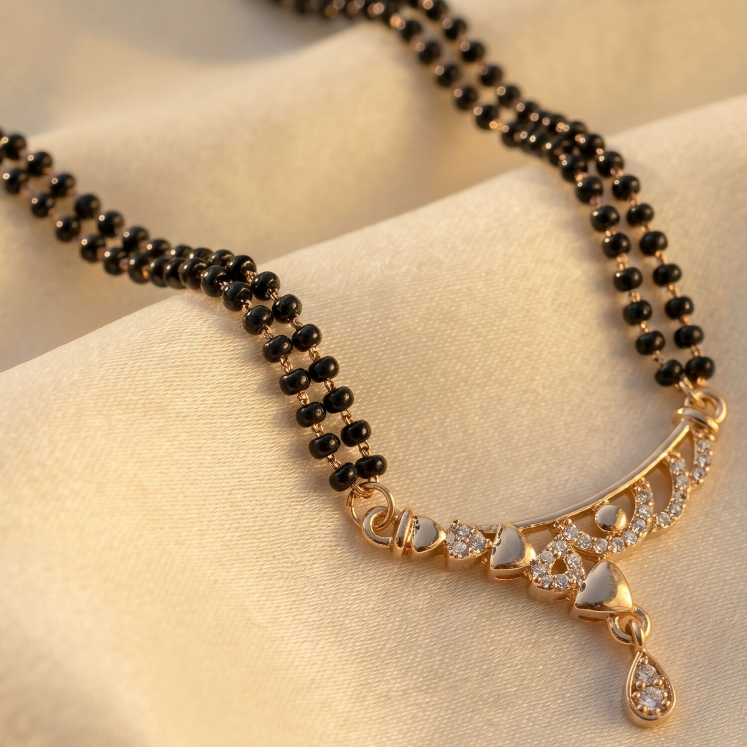 Rose Gold Finish Triple Strand Heart Charms & CZ Bar Mangalsutra with Teardrop Drop