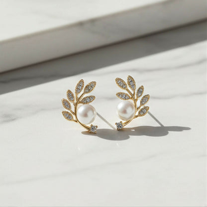 Crystal and pearl details on botanical ear climbers