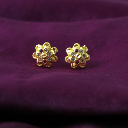 Side view of floral-shaped stud earrings with sparkling crystals