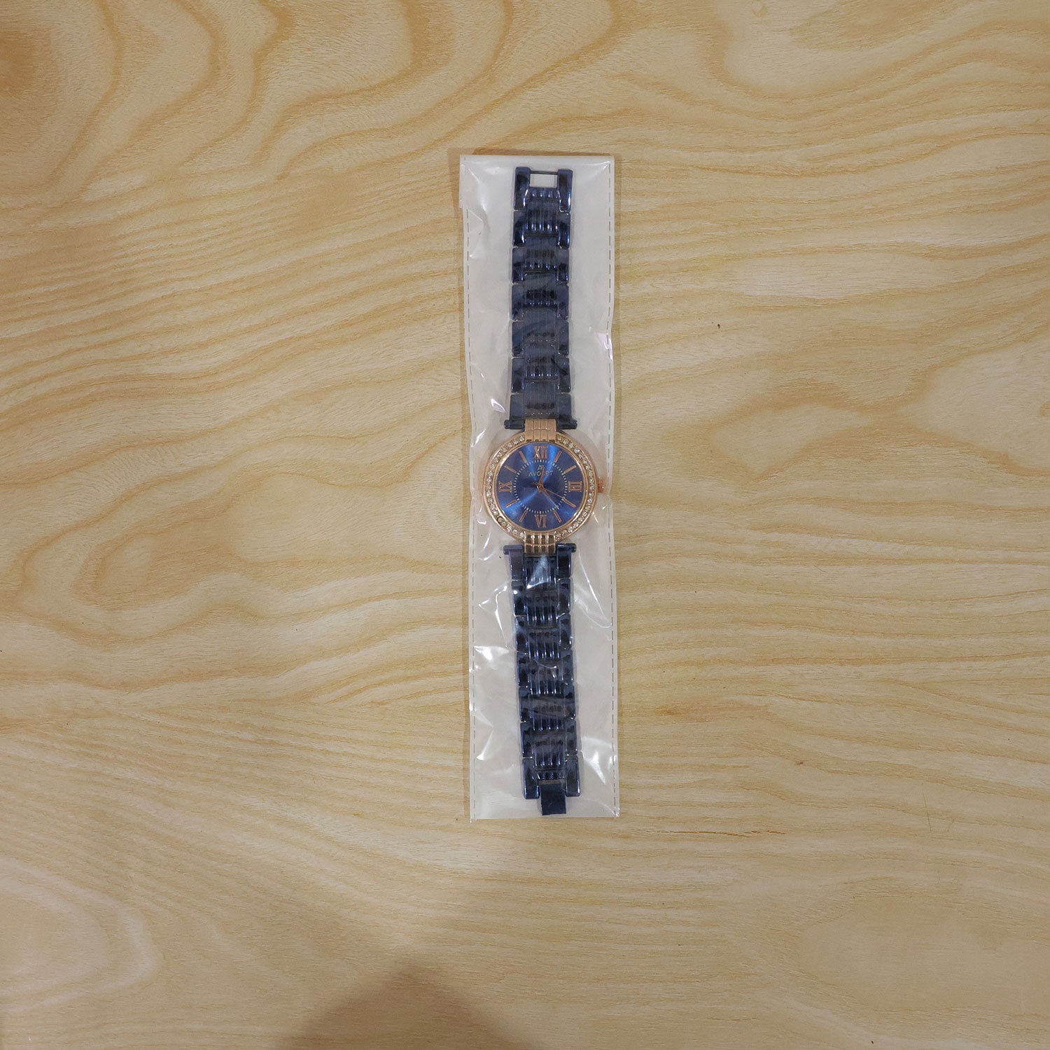 Detailed view of the women's blue analog watch, emphasizing its refined craftsmanship.