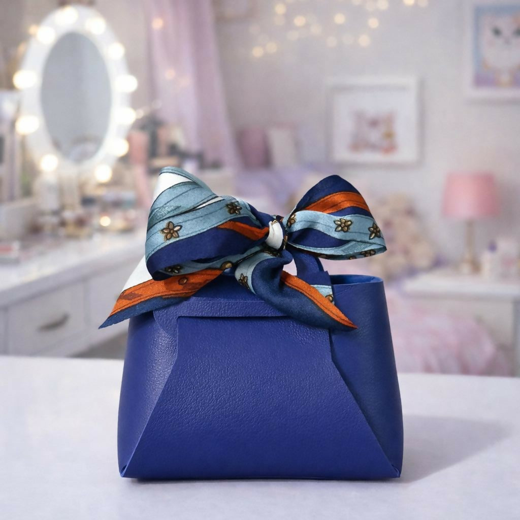 Side view of blue mini handbag organizer with decorative bow