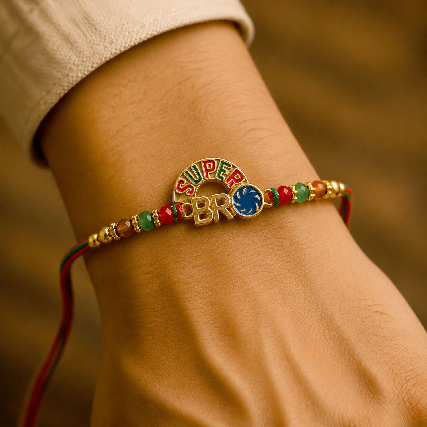 Super Bro Golden Rakhi with Colorful Beads, Blue Charm and Premium Festive Look