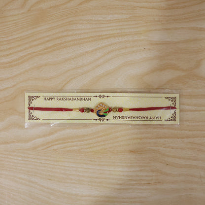 Peacock Feather Rakhi with Red Beads and Cute Mor Charm