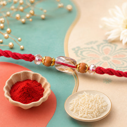 Red Thread Rakhi with Wooden and Sparkling Crystal Bead Pendant