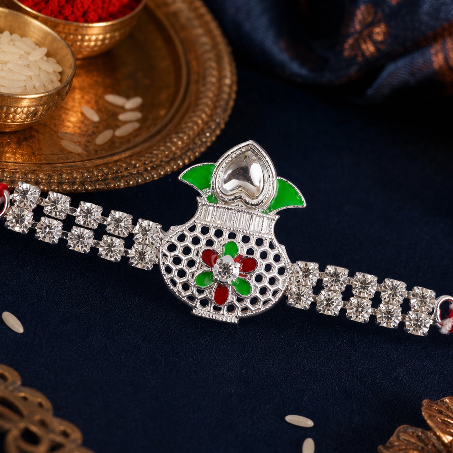 Premium Rakhi showcasing Kalash Charm, gold trims and thread style for Gift Styling