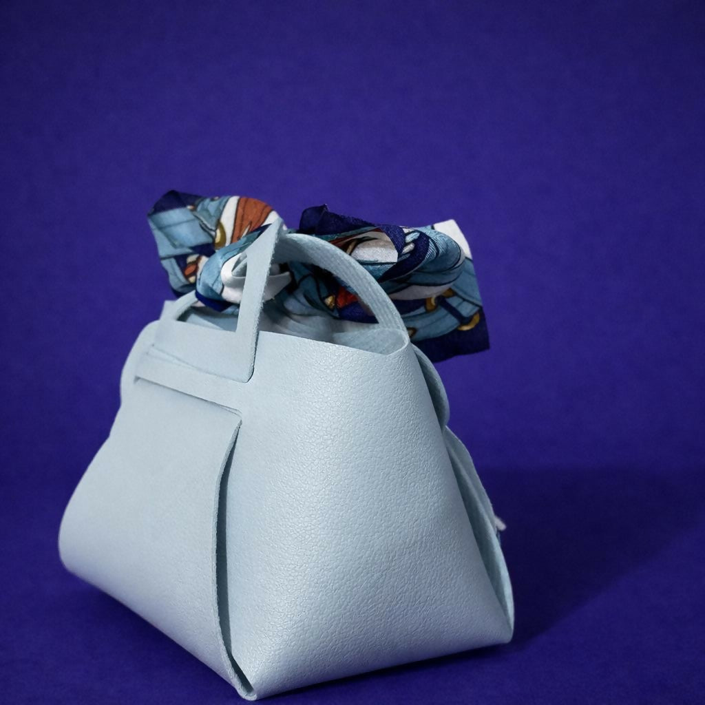 Side view of mini handbag organizer with bow