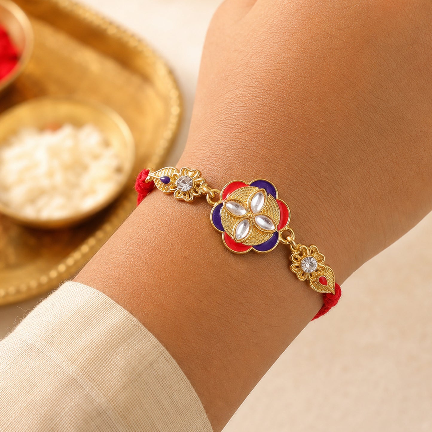 Festive Rakhi showcasing Decorative Rosette, pearl accents and bead line for Gifting