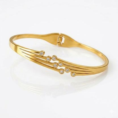 Side view of botanical kada bracelet showing linked flower segments
