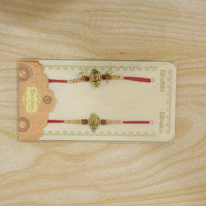 Antique Paisley Couple Rakhi Set with Rudraksha Beads and Pearl Lumba Charm Design