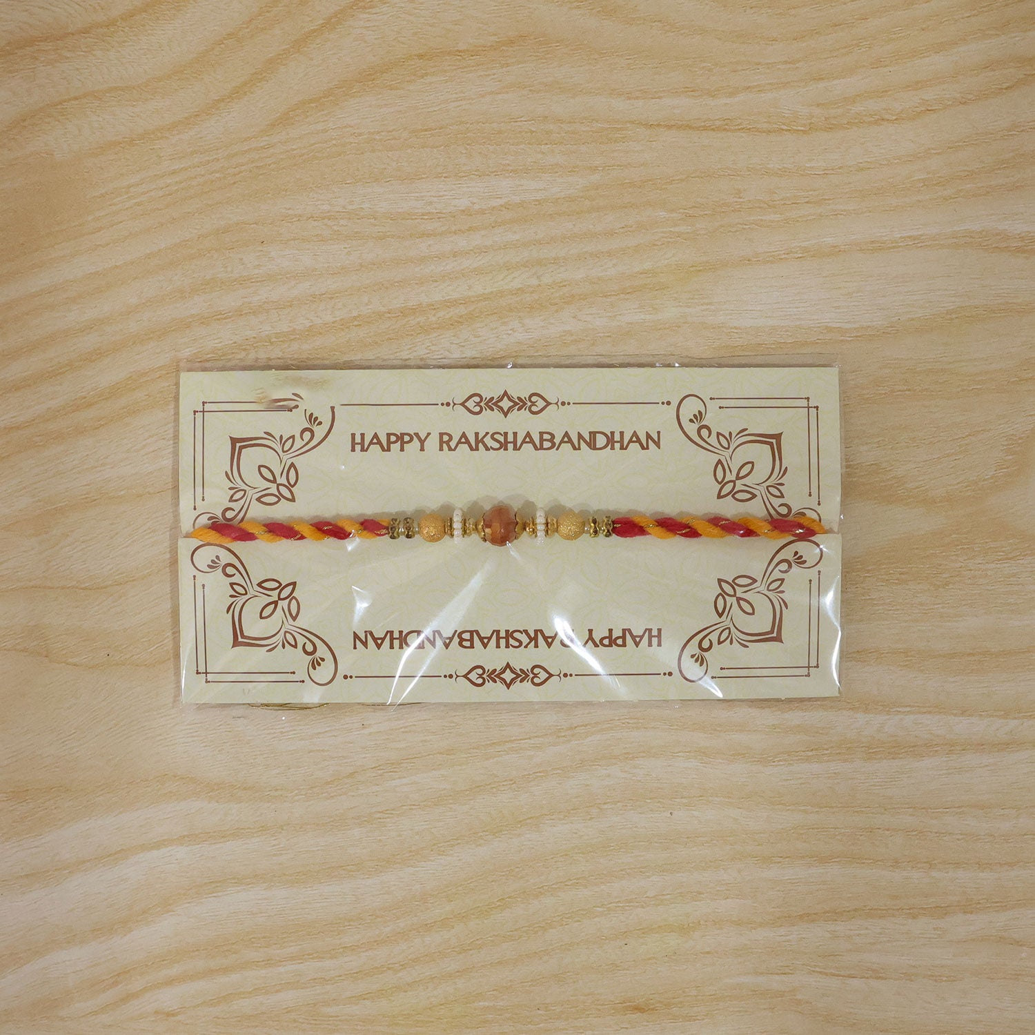 Beautiful Pearl Bead Rakhi with Soft Festive Shades and Elegant Designer Look