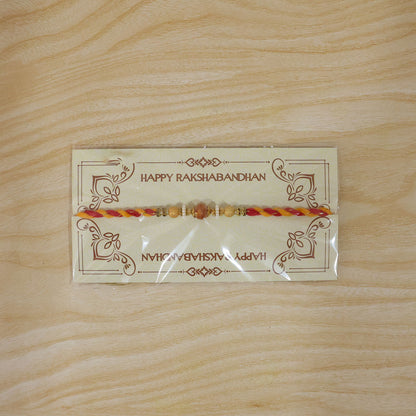 Beautiful Pearl Bead Rakhi with Soft Festive Shades and Elegant Designer Look