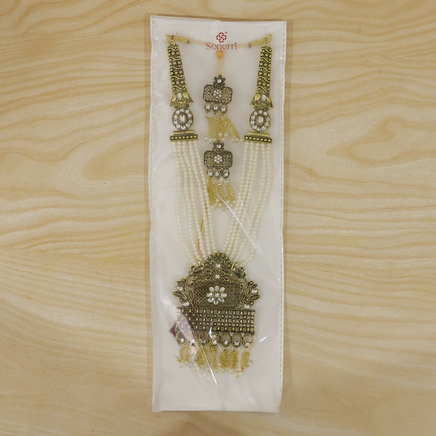 Traditional pearl necklace set styled for festive wear