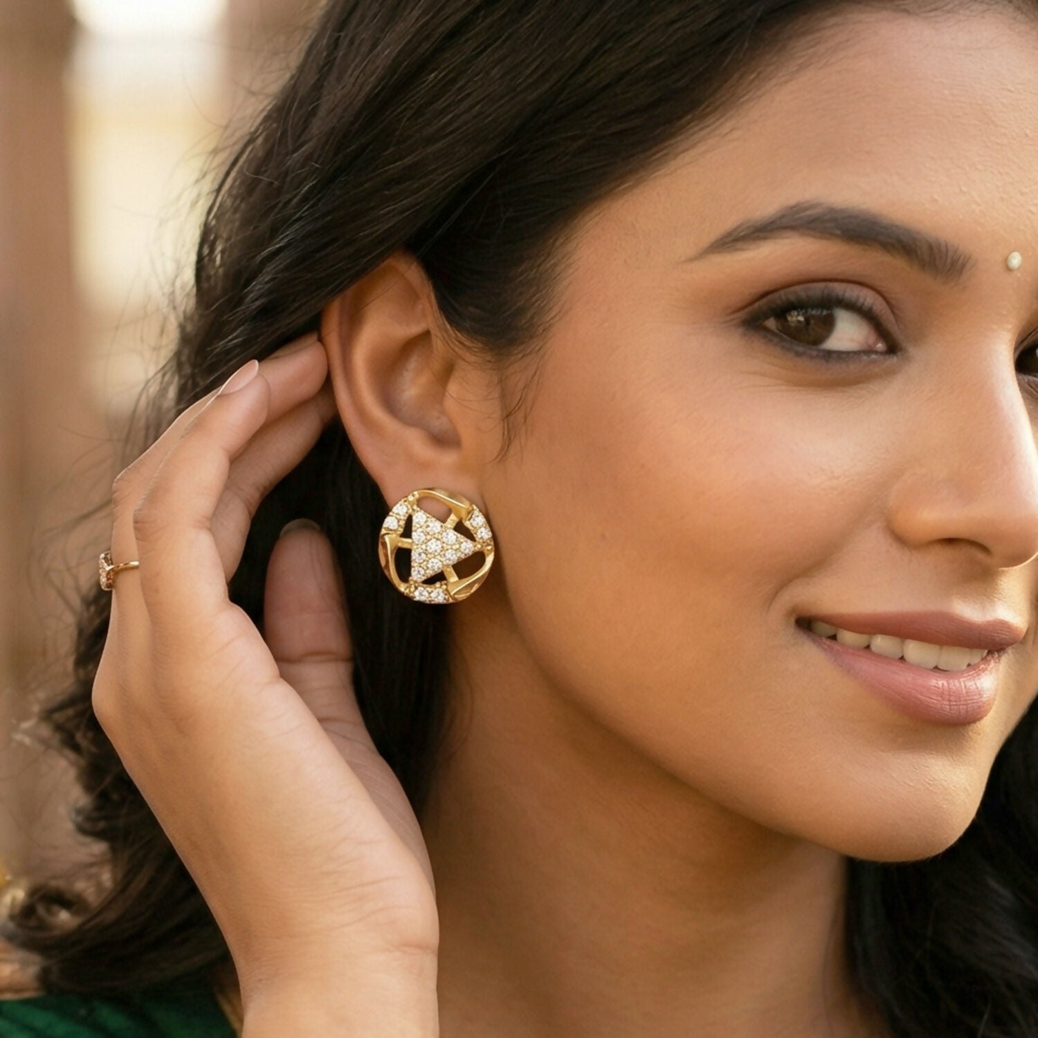 Elegant gold earrings featuring bell shape and detailed craftsmanship