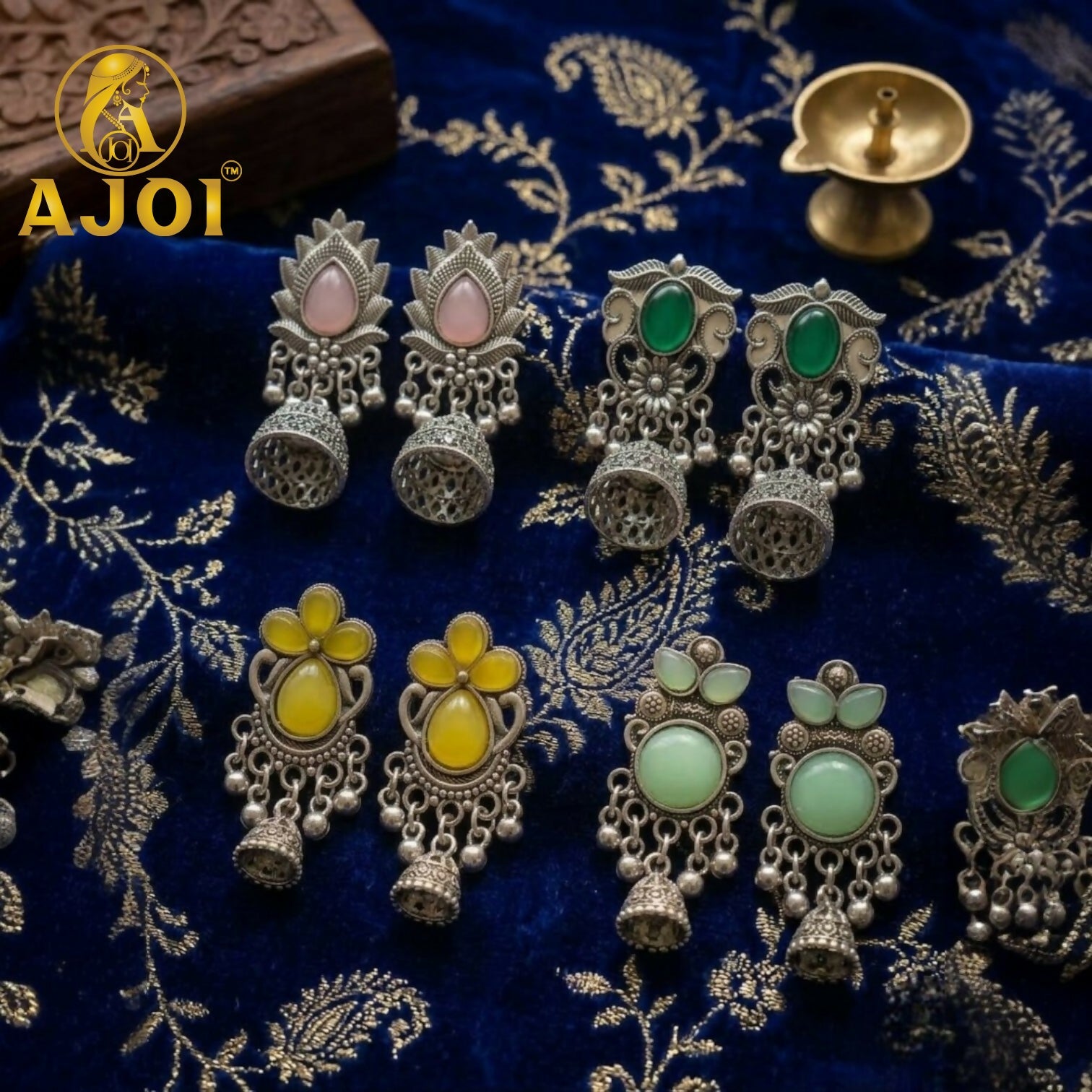 Side view of oxidized silver jhumka earrings displaying ghungroo bead detailing