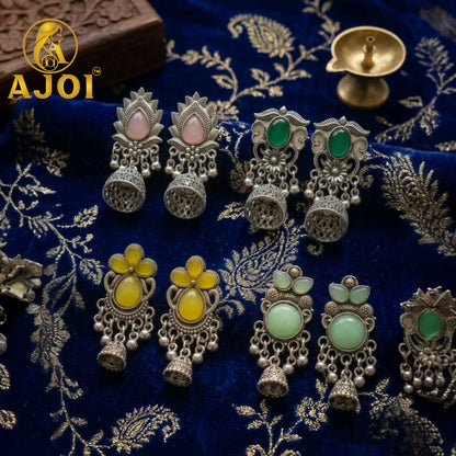 Side view of oxidized silver jhumka earrings displaying ghungroo bead detailing