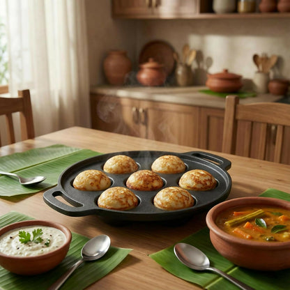 Side angle of cast iron paniyaram maker with dual handles