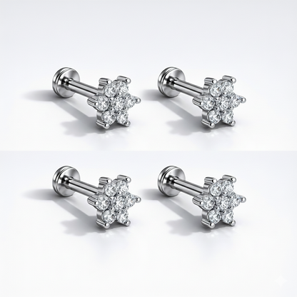 Pair of silver plated crystal flower labret stud earrings shown on white background