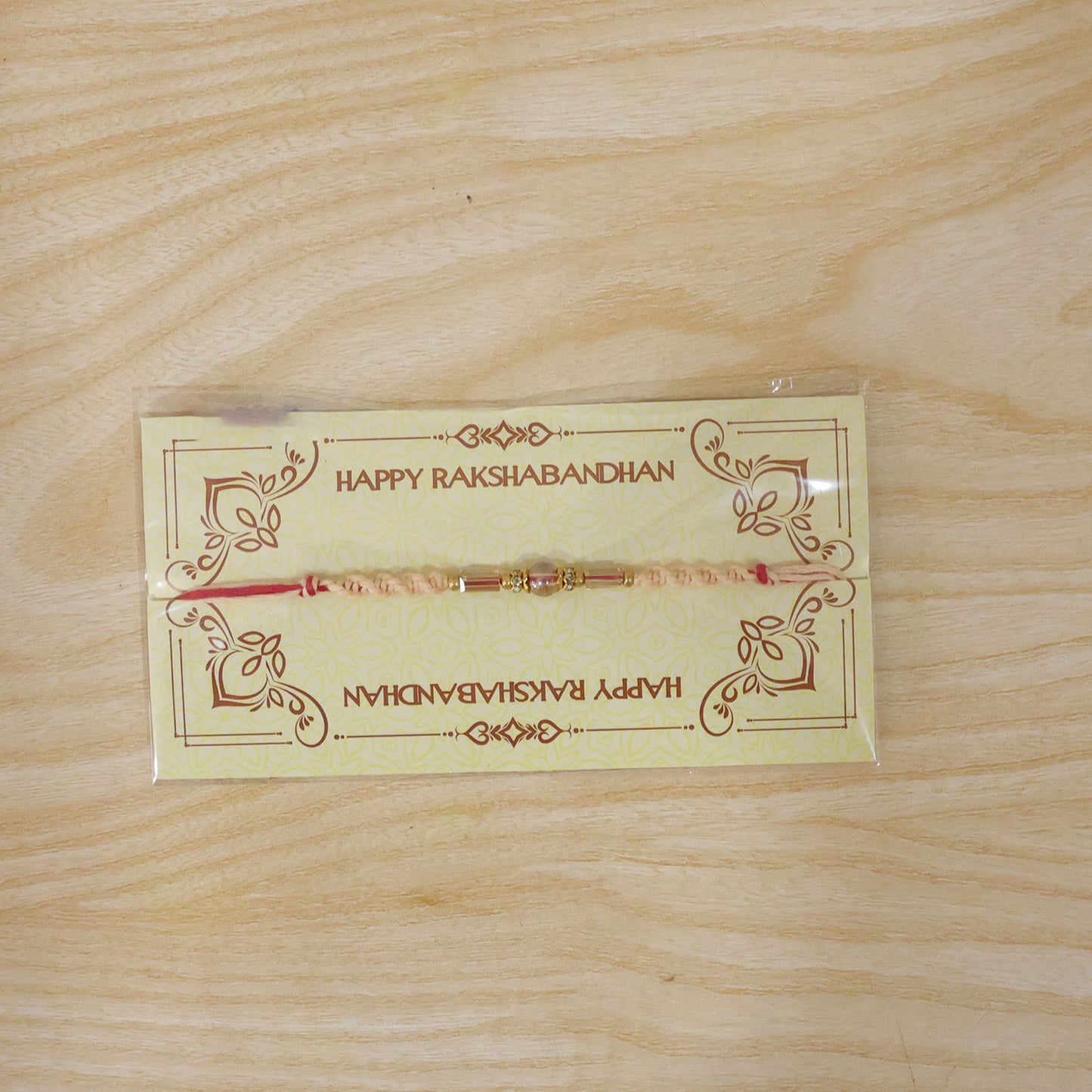 Sparkling Pearl Stone Rakhi with Colorful Thread and Premium Festive Beauty