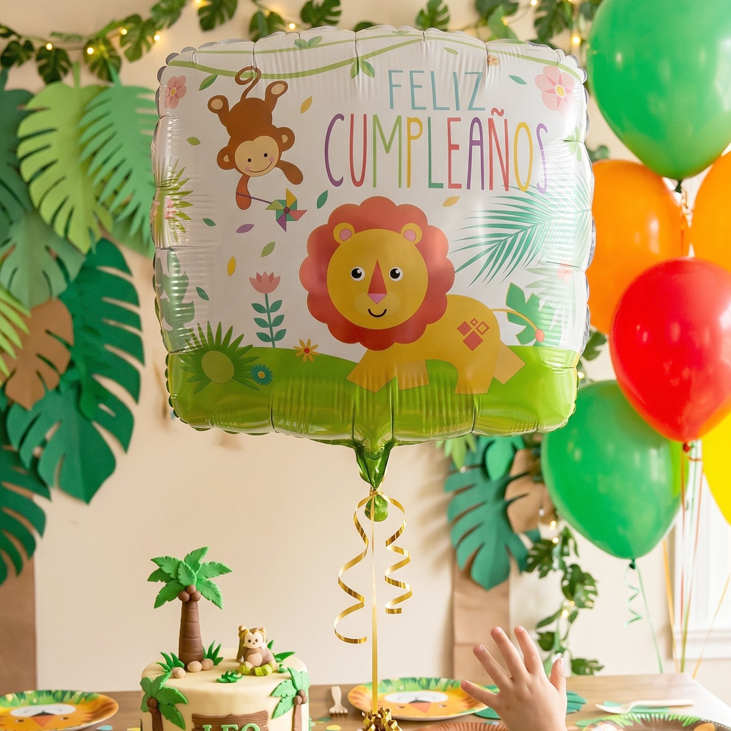 Birthday cake table decorated with jungle lion foil balloon