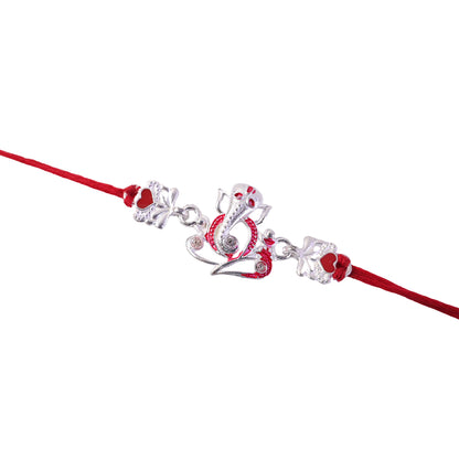 Silver Ganesha Rakhi with Red Stone Hearts and Deep Velvet Look