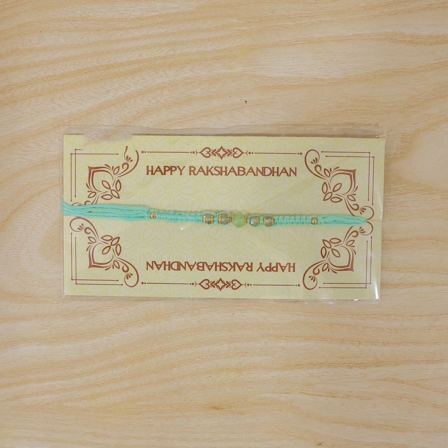 Beautiful Pearl and Stone Rakhi with Bright Beads and Elegant Raksha Bandhan Look