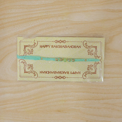 Beautiful Pearl and Stone Rakhi with Bright Beads and Elegant Raksha Bandhan Look