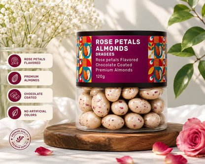 A hand gently holding the Oracle Rose Petal Almond Dragees jar, showcasing its premium packaging.
