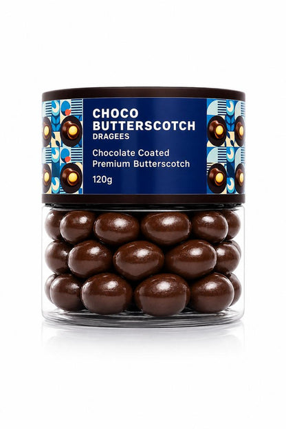 A single Choco Butterscotch Dragee on a spoon, ready to be enjoyed as a sweet, crunchy butterscotch treat.