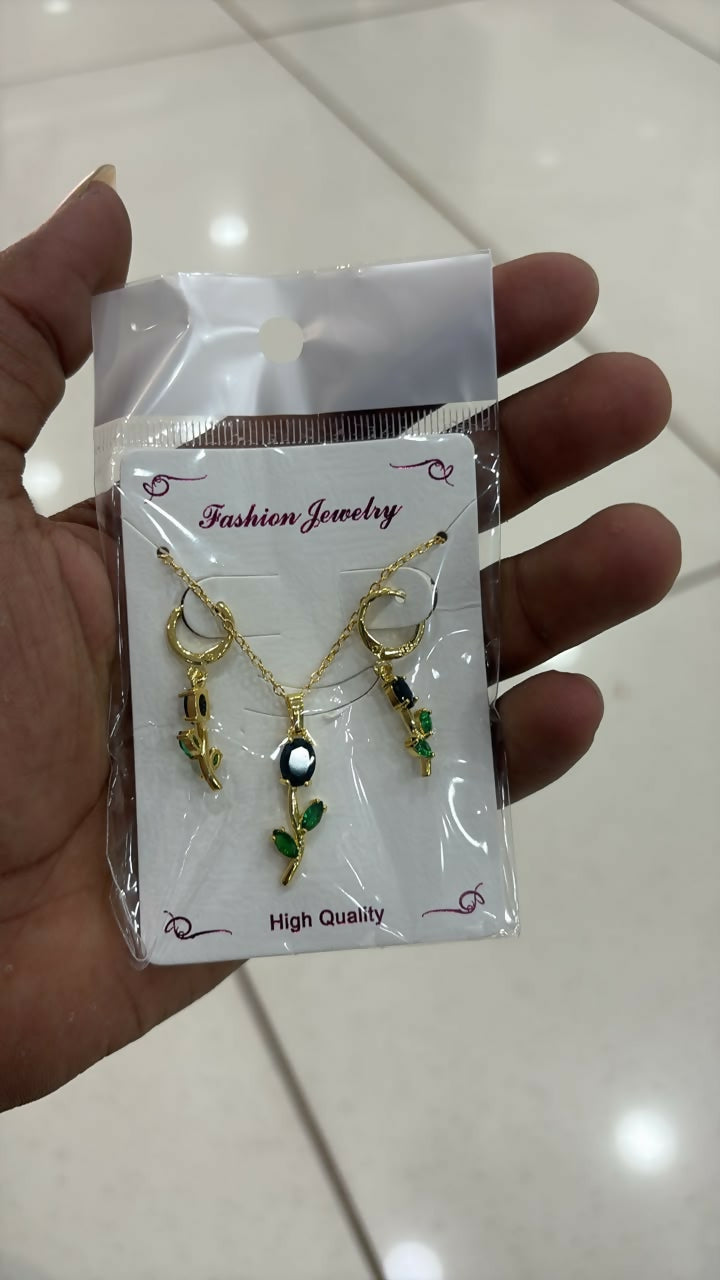 Lifestyle shot of the green stone pendant necklace set enhancing a festive look.