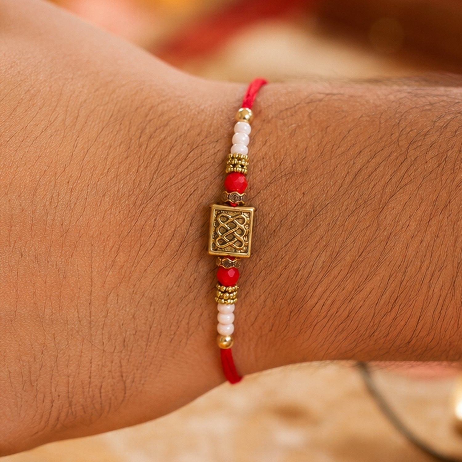 Geometric Rectangle Bhai Bhabhi Rakhi with Rectangular Emblem and Pearls for Gifting