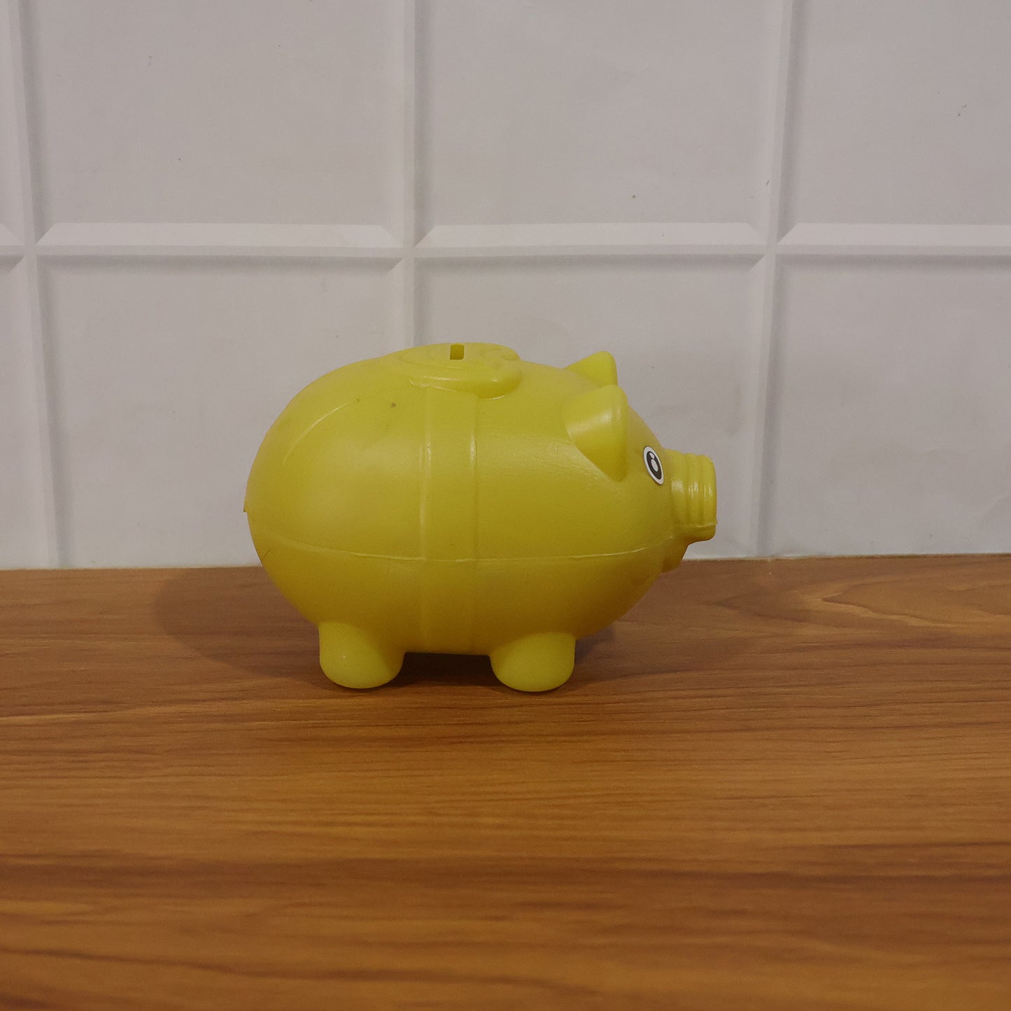 Kids piggy money bank displayed in room
