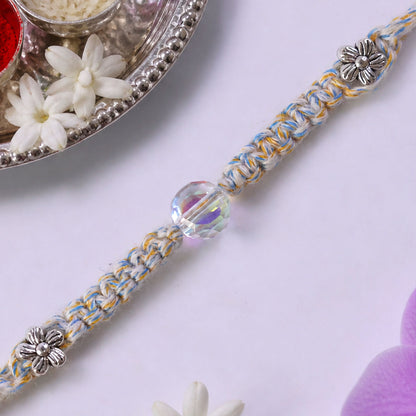 Pastel Braided Rakhi with Blue-White Thread and Crystal Bead Charm for Raksha Bandhan