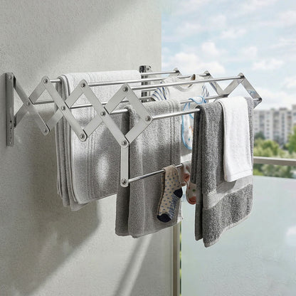 Foldable drying stand mounted on wall with clothes drying