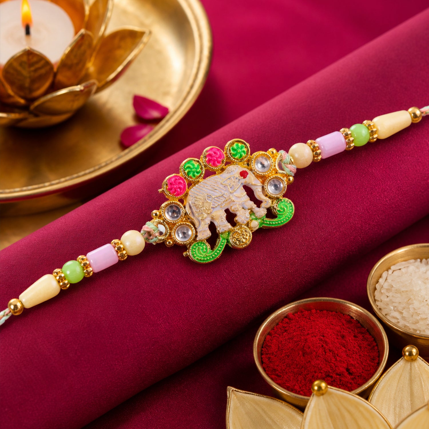 Festive Rakhi showcasing Elephant Charm, gold trims and display look for Gift Use