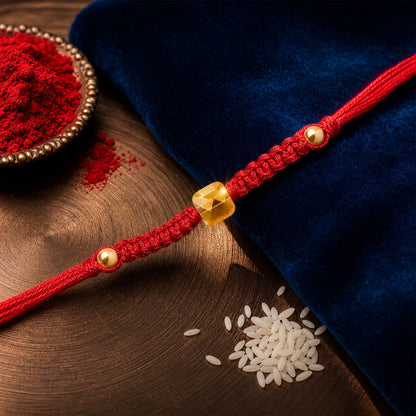 Red Braided Rakhi with a Bold Square Amber Crystal Bead Pendant