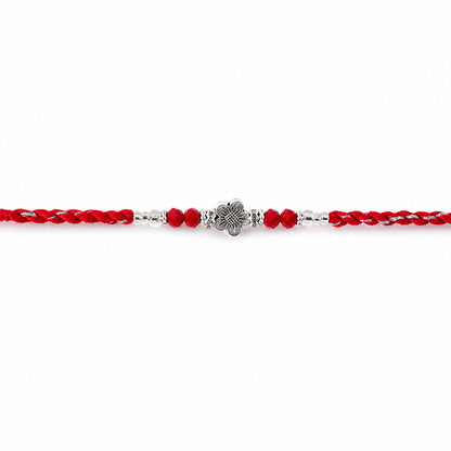 Red Braided Rakhi with Silver Flower Charm and Crystal Bead Accents