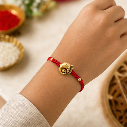 Red Thread Rakhi with Antique Gold Elephant-Shaped Charm Pendant