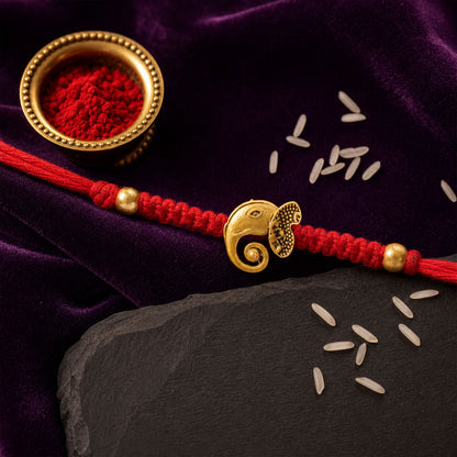 Red Thread Rakhi with Antique Gold Elephant-Shaped Charm Pendant