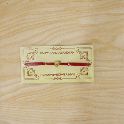 Red Thread Rakhi with Antique Gold Elephant-Shaped Charm Pendant