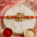 Shivling Trishul Devotional Rakhi – Golden Lord Shiva Centre