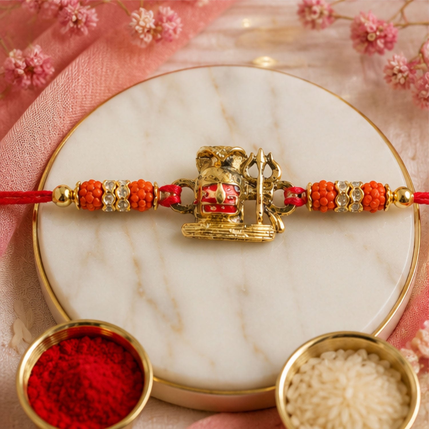 Shivling Trishul Devotional Rakhi with Golden Lord Shiva Centre and Orange Beads
