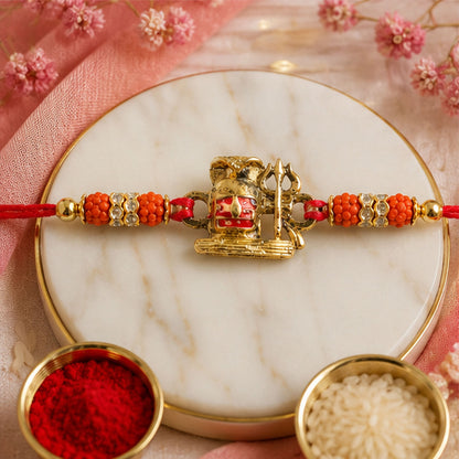 Shivling Trishul Devotional Rakhi with Golden Lord Shiva Centre and Orange Beads