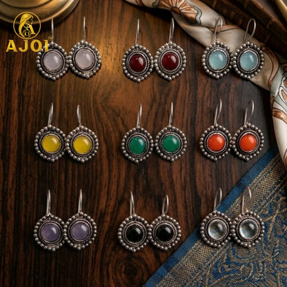 Oxidized silver earrings displayed with festive outfit