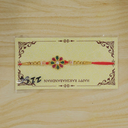Radiant Floral Rakhi Adorned with Pink-Green Stones, Pearls and Gold-Tone Beads (10pcs)