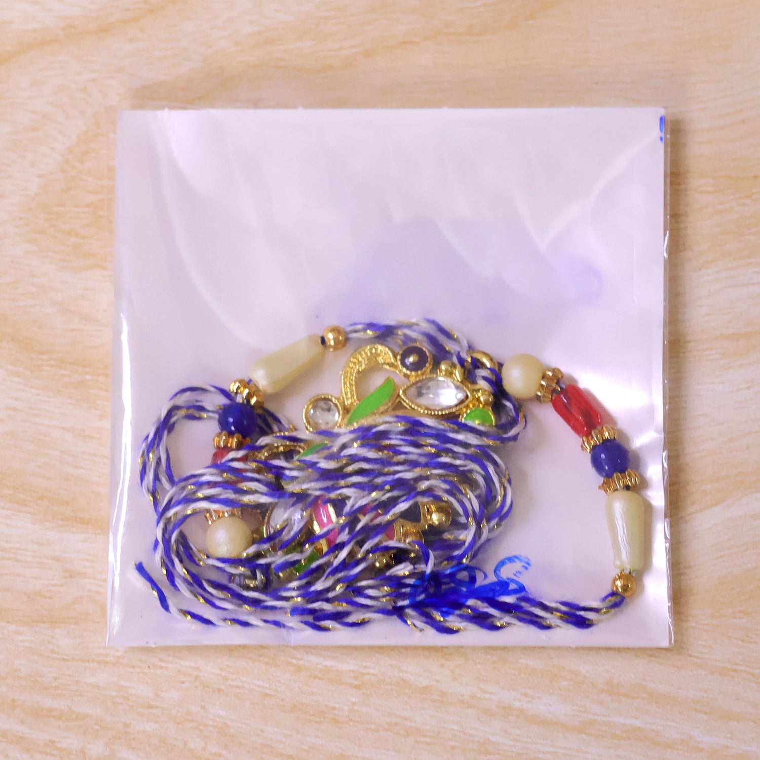 Lotus Flower Enamel Pendant Rakhi with Navy Pearl Beads