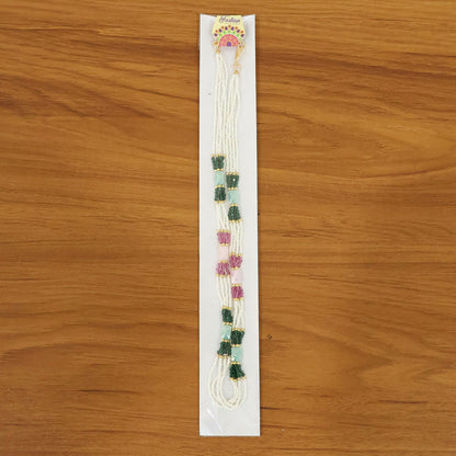 Multicolor handmade mala necklace displayed on stand