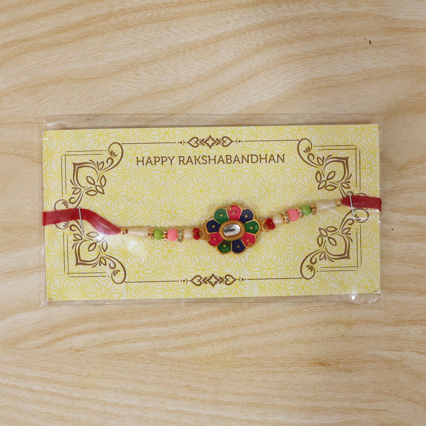 Multicolor Flower Rakhi with Pastel Beads and Fresh Festive Look