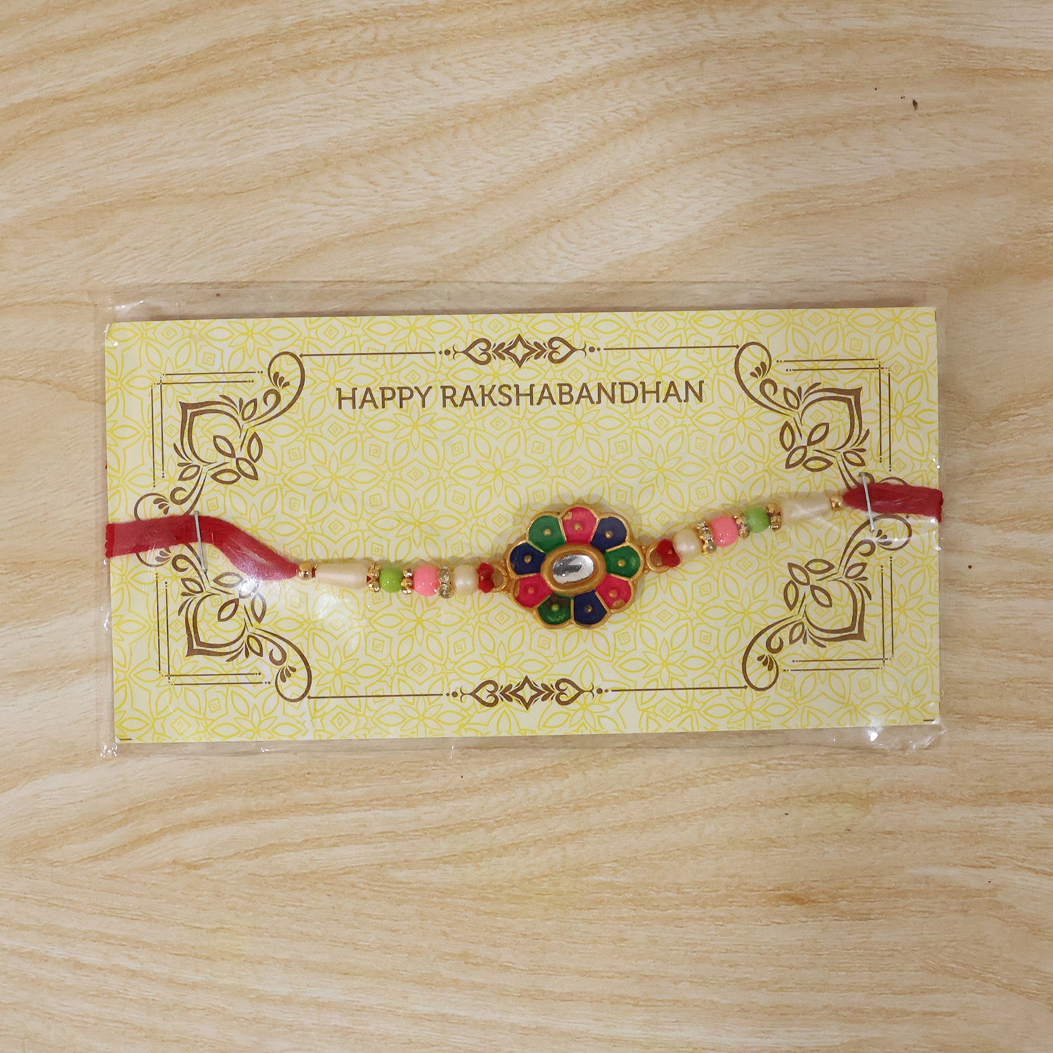 Multicolor Flower Rakhi with Pastel Beads and Fresh Festive Look