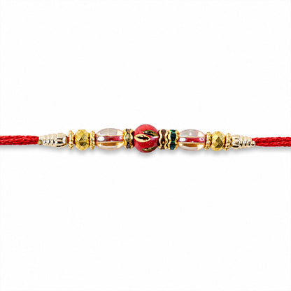 Red Enamel Golden Designer Rakhi with Transparent Beads and Rich Festive Shine